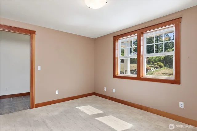 a view of an empty room and window