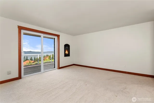 a view of a hallway with closet and cabinet
