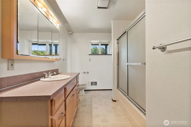 a view of a room with chairs and table
