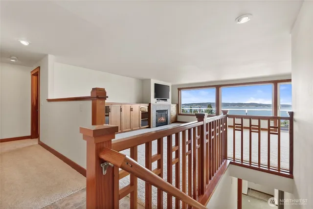 a view of a living room hardwood floor and a kitchen
