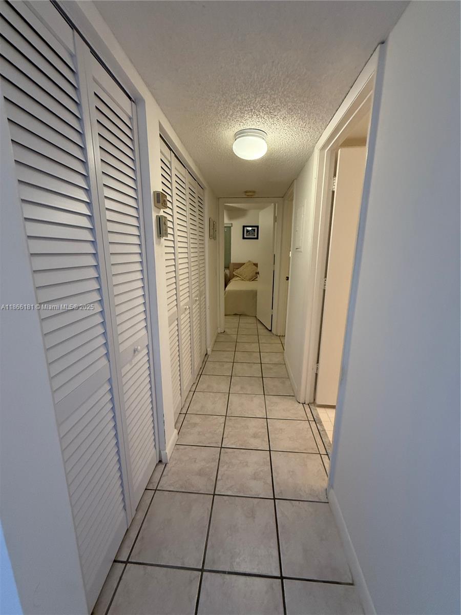 657 Waterside Drive, Unit 657 Hypoluxo, FL 33462 - Photo 14 of 17 a view of a hallway in a house