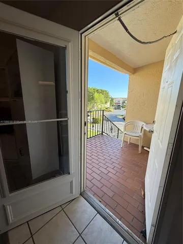 a view of a balcony with wooden floor