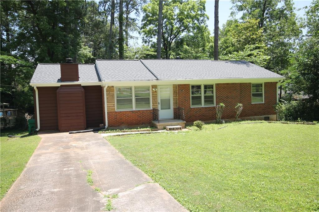3119 Beech Drive Decatur, GA 30032 - Photo 1 of 1 a front view of a house with a garden and yard