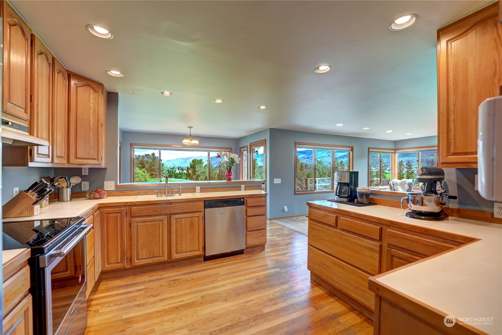 6 Rising Eagle Road Twisp, WA 98856 - Photo 17 of 40 a large kitchen with stainless steel appliances a stove a sink a refrigerator and cabinets