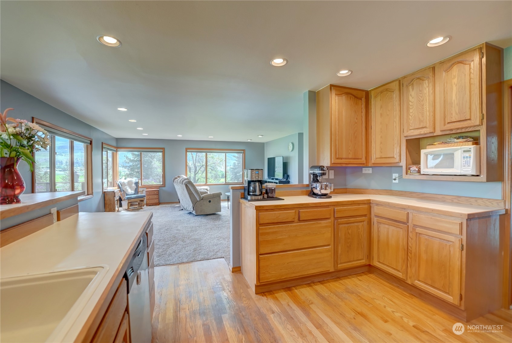 6 Rising Eagle Road Twisp, WA 98856 - Photo 18 of 40 a large kitchen with kitchen island granite countertop a large window cabinets and stainless steel appliances