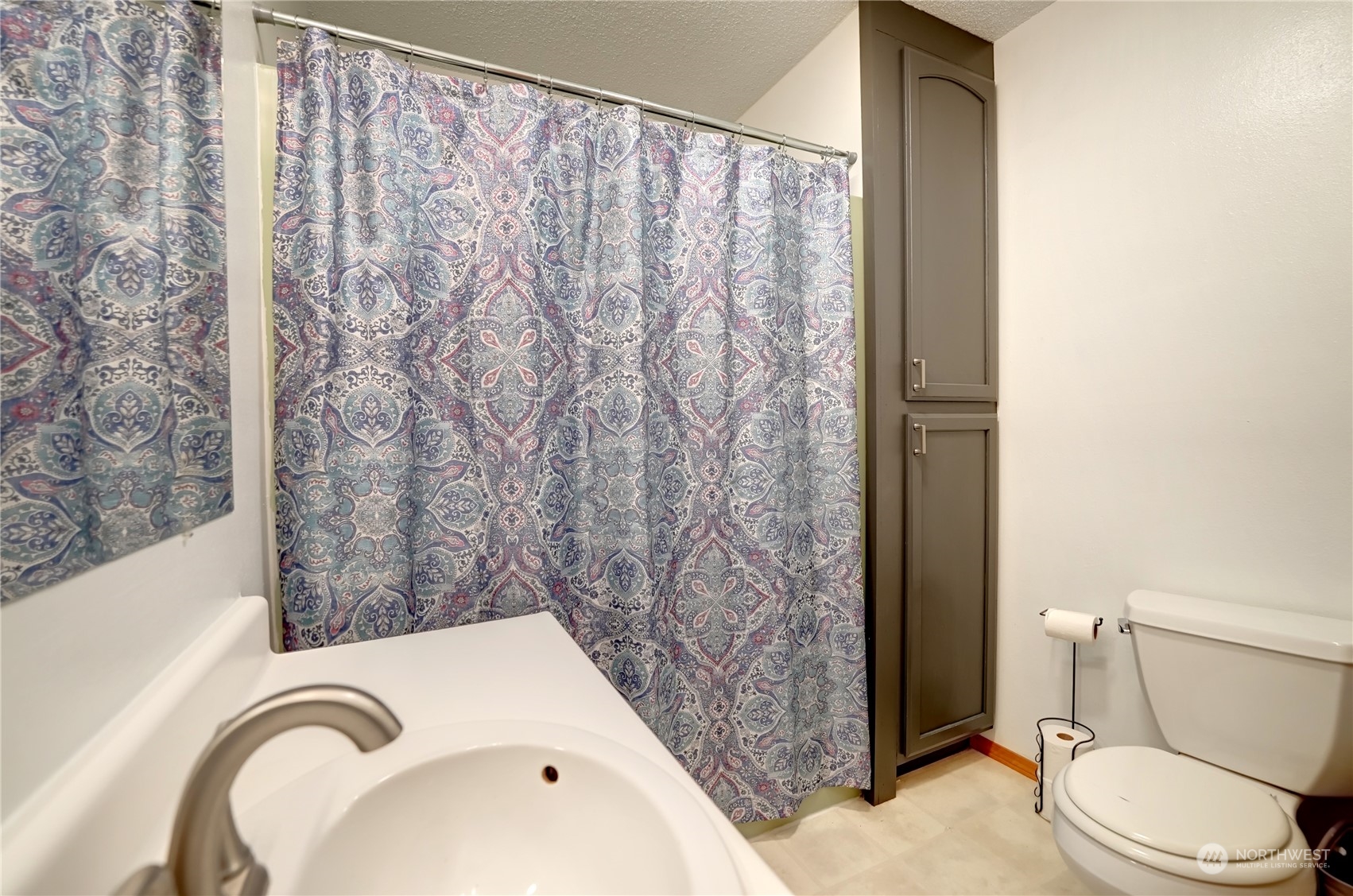 6 Rising Eagle Road Twisp, WA 98856 - Photo 19 of 40 a bathroom with a toilet and a sink