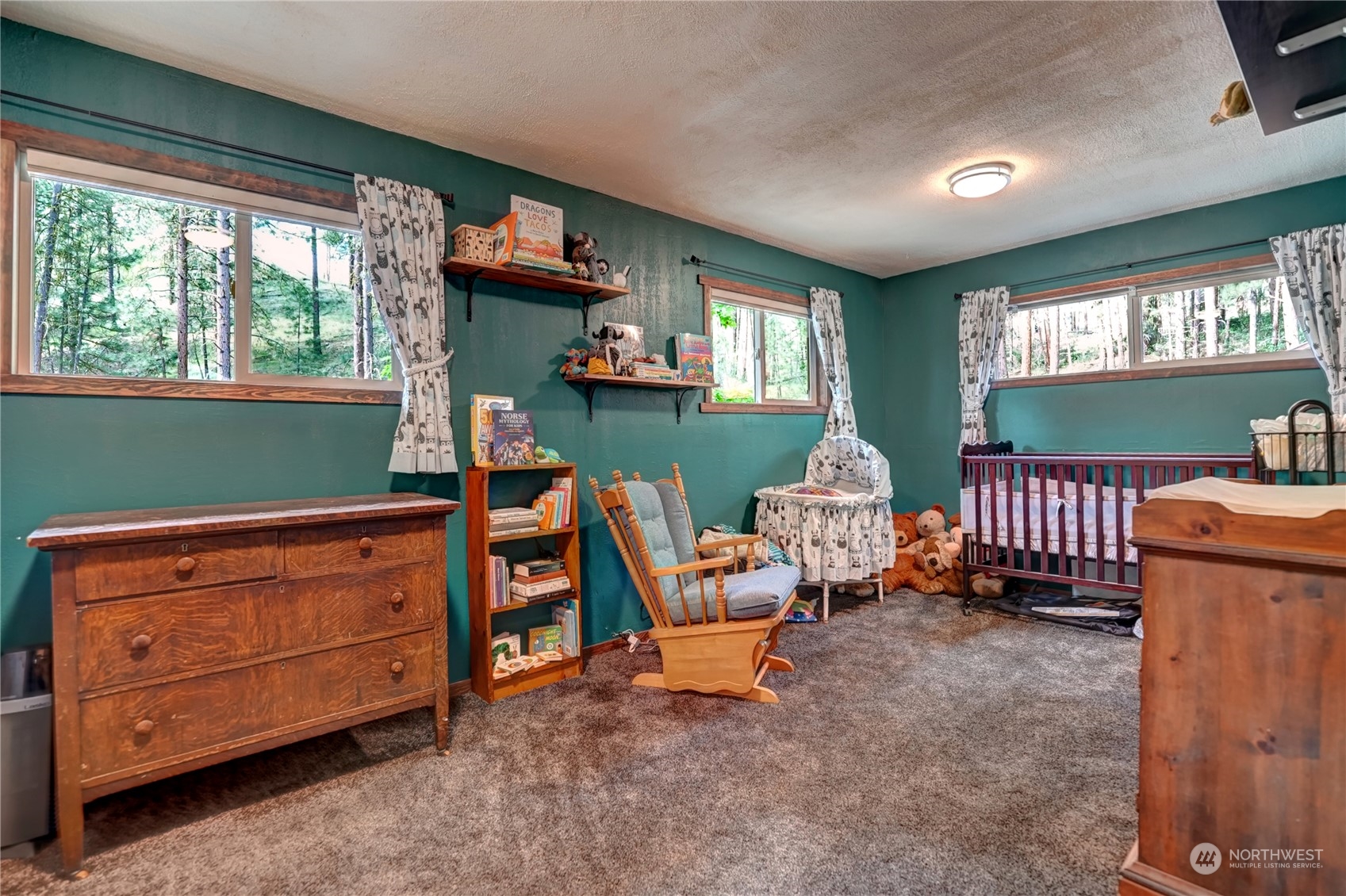 6 Rising Eagle Road Twisp, WA 98856 - Photo 21 of 40 a room with furniture toys and a window