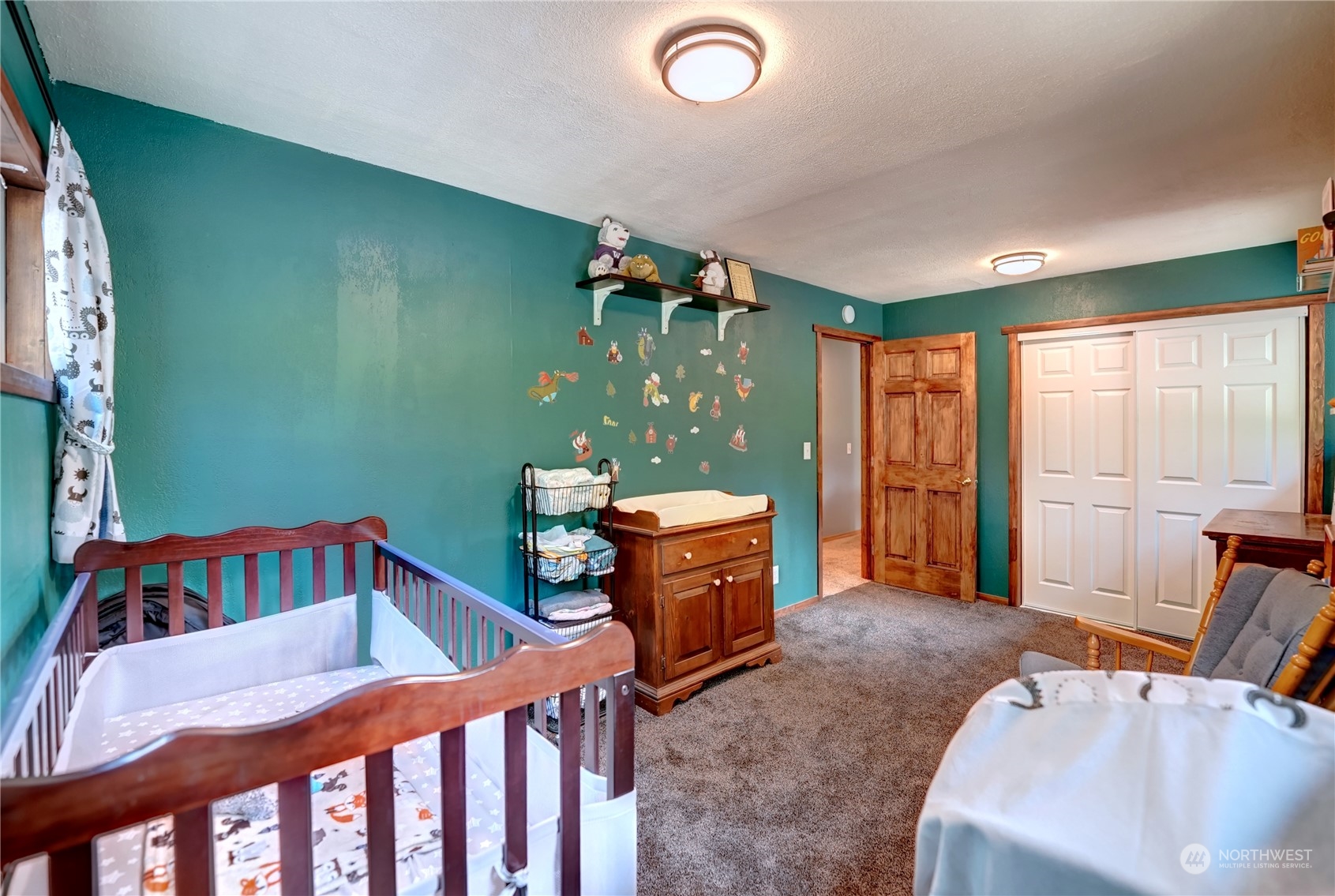 6 Rising Eagle Road Twisp, WA 98856 - Photo 22 of 40 a bedroom with furniture and a window