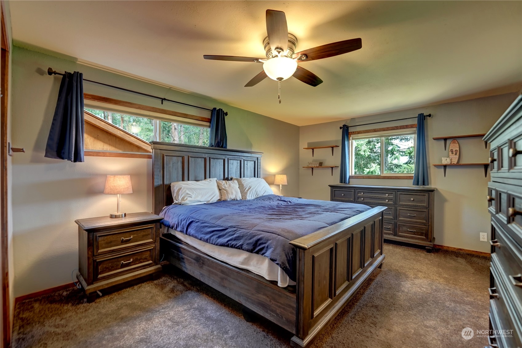 6 Rising Eagle Road Twisp, WA 98856 - Photo 23 of 40 a bedroom with a bed and a chandelier