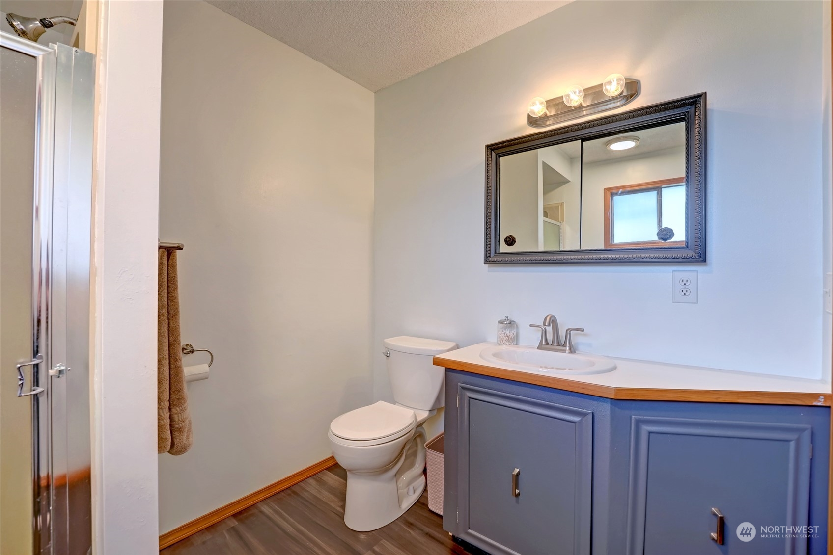 6 Rising Eagle Road Twisp, WA 98856 - Photo 25 of 40 a bathroom with a toilet sink and mirror
