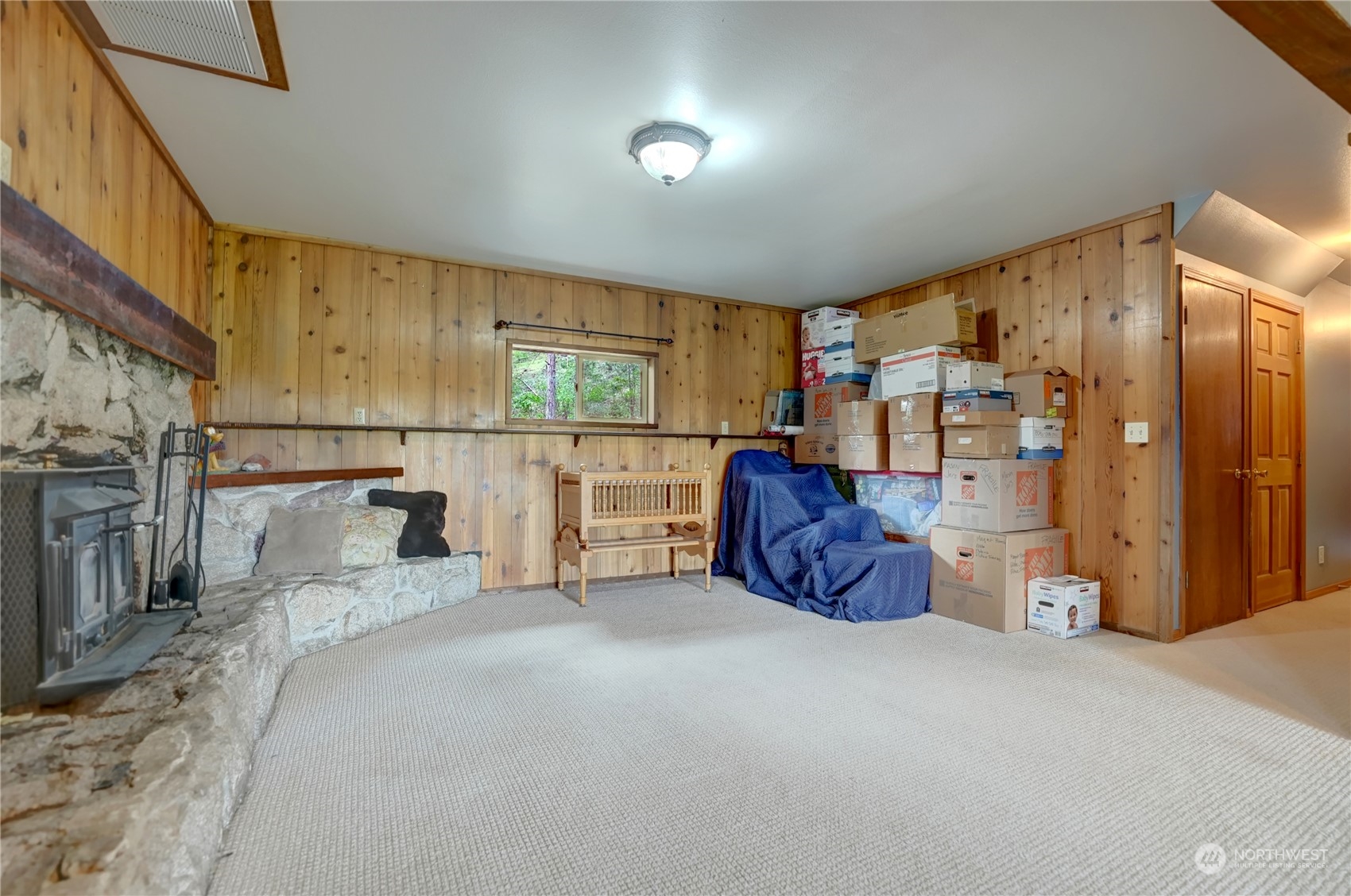 6 Rising Eagle Road Twisp, WA 98856 - Photo 28 of 40 a spacious bedroom with a bed and a large window
