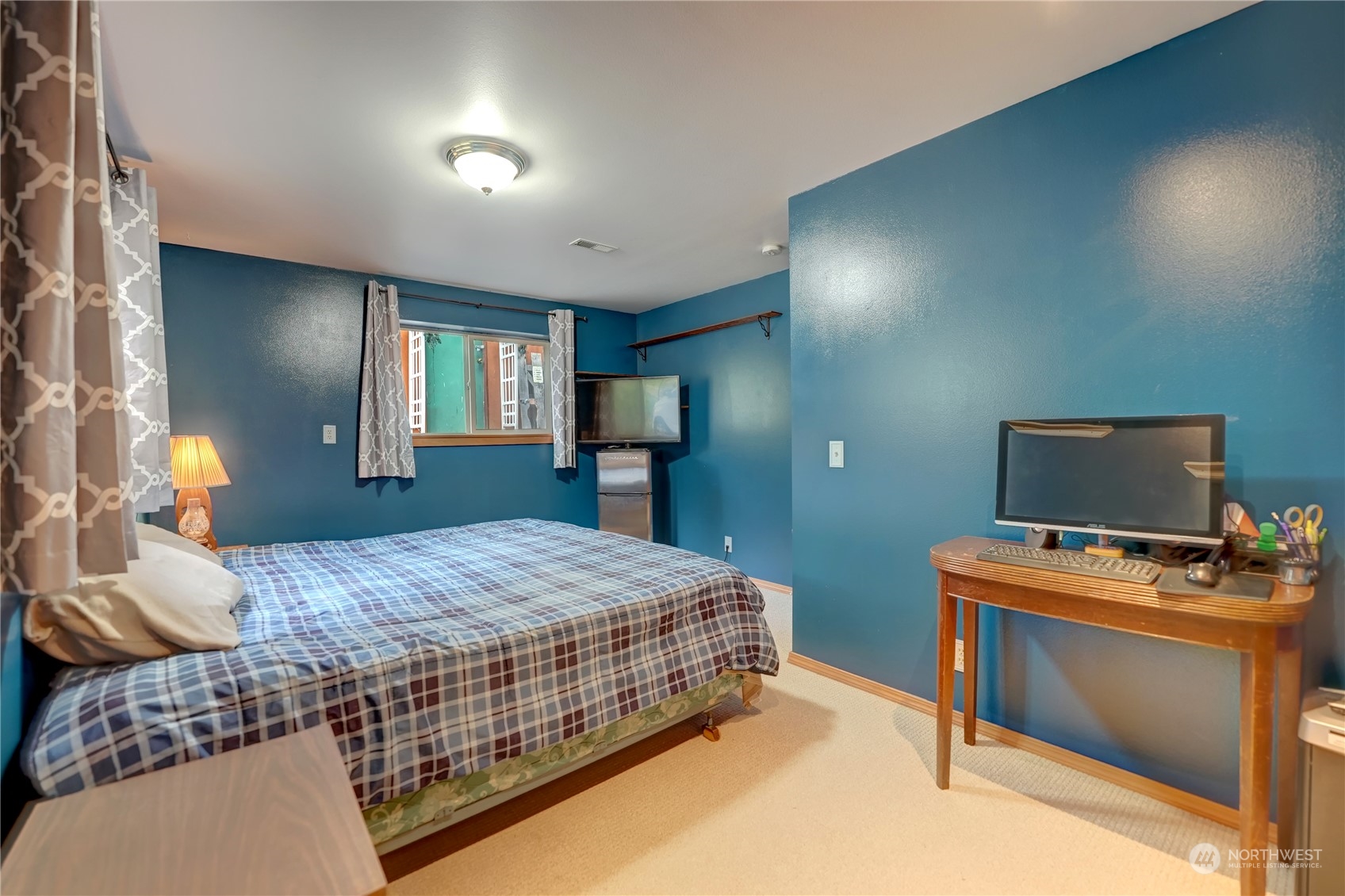 6 Rising Eagle Road Twisp, WA 98856 - Photo 32 of 40 a bedroom with a bed and a flat screen tv