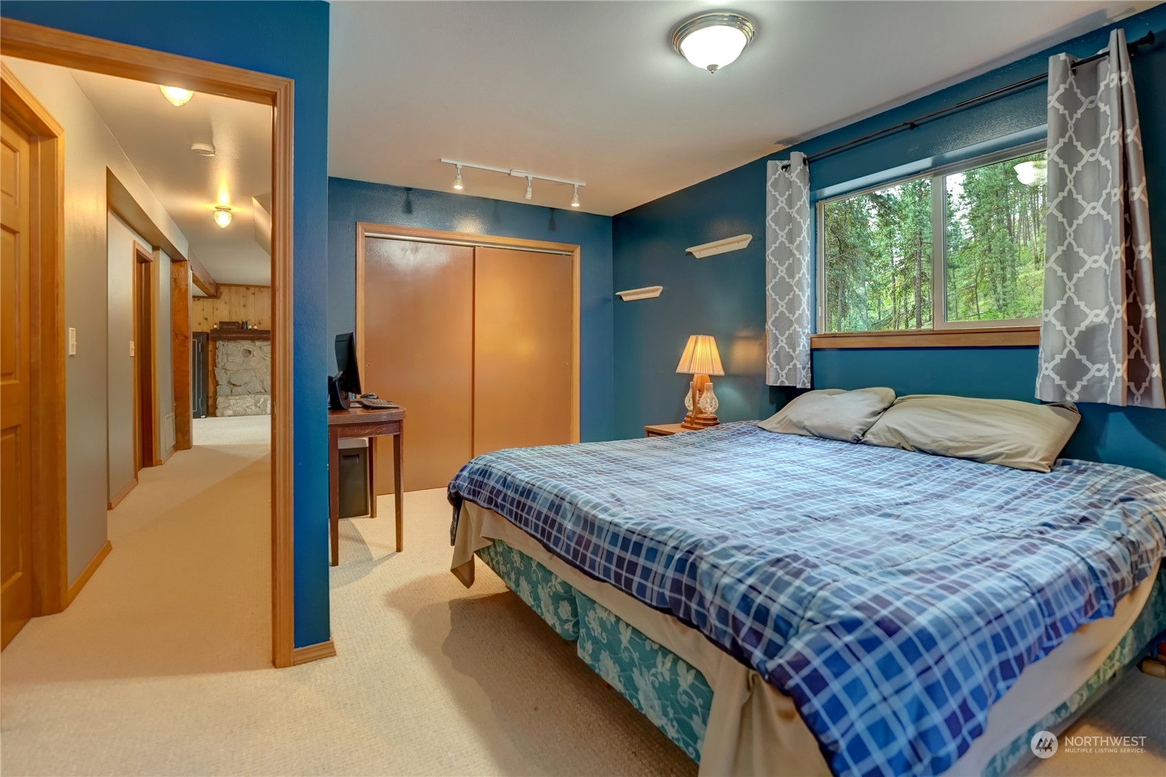 6 Rising Eagle Road Twisp, WA 98856 - Photo 33 of 40 a bedroom with a large bed and a large window