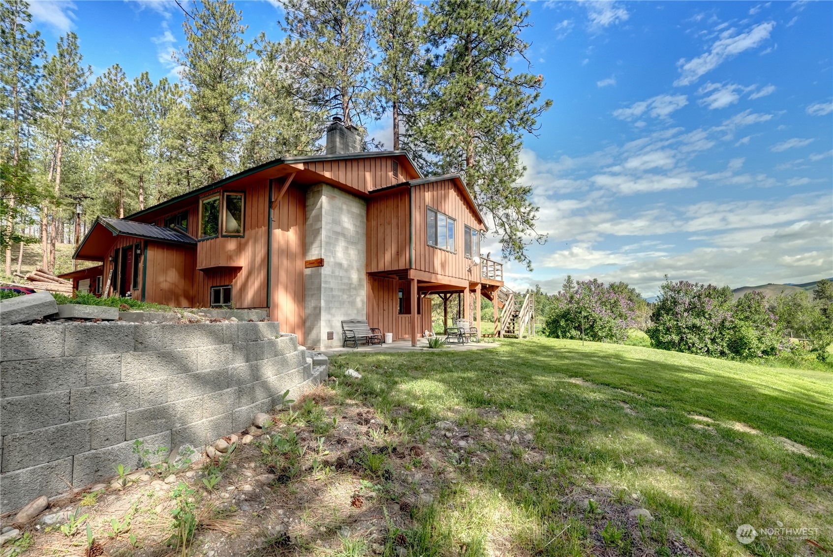 6 Rising Eagle Road Twisp, WA 98856 - Photo 36 of 40 a view of a house with a big yard plants and large trees