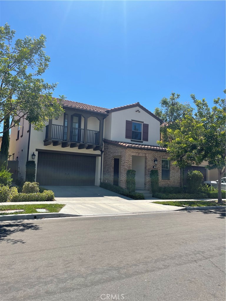 112 Mountain Violet Irvine, CA 92620 - Photo 1 of 1 a front view of a house with a yard