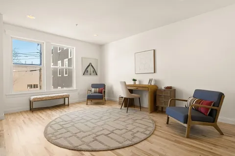 a living room with furniture and a table
