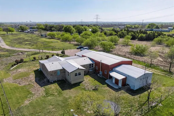 an aerial view of a house with pool big yard and outdoor seating