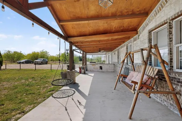 a view of swimming pool with outdoor seating and city view