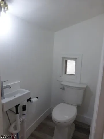 a bathroom with a toilet and a sink
