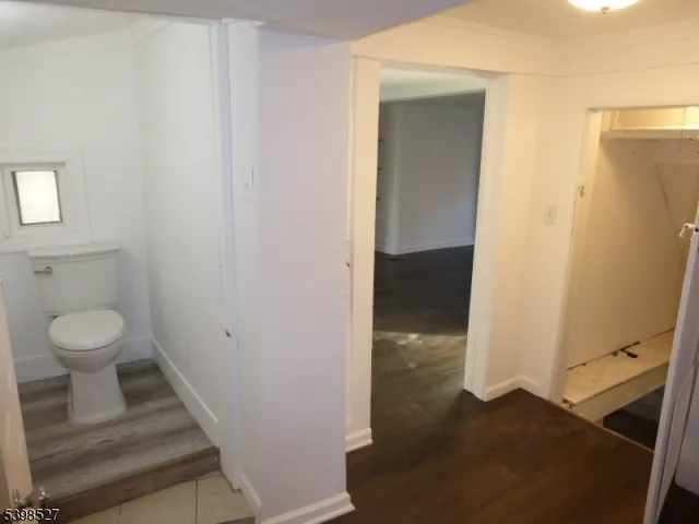 a bathroom view of a toilet and a sink