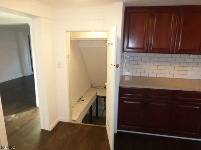 a kitchen with a sink and a refrigerator