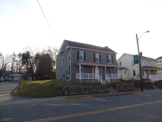 a view of a street in front of a house