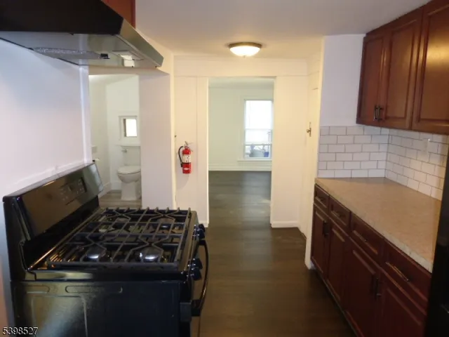 a kitchen with a stove and a refrigerator