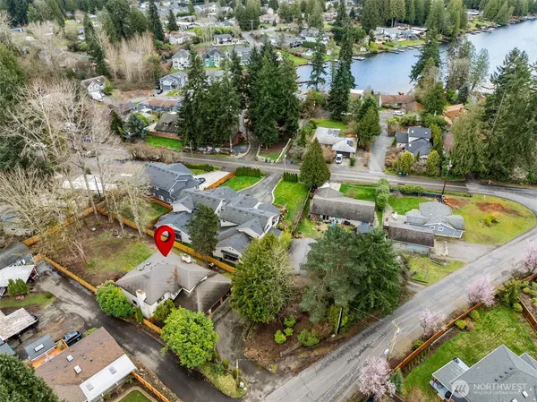an aerial view of a house with a swimming pool