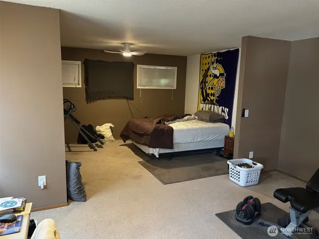 a bedroom with bed and a window