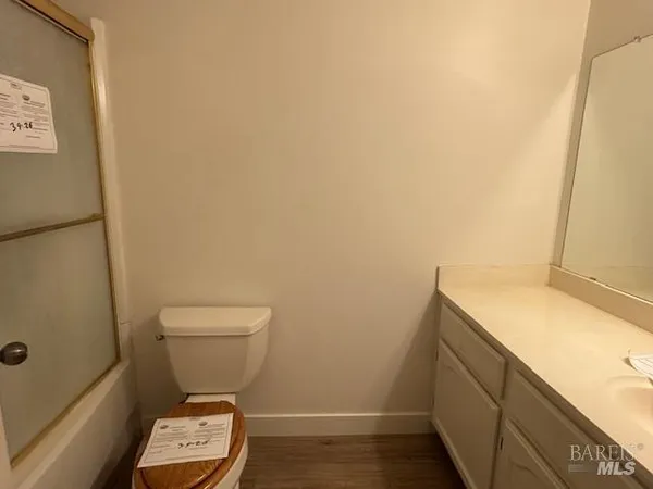 a bathroom with a toilet and a sink