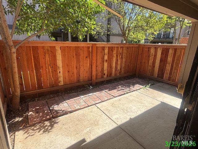 1801 Marshall Road, Unit 403 Vacaville, CA 95687 - Photo 6 of 7 a view of a backyard with wooden fence