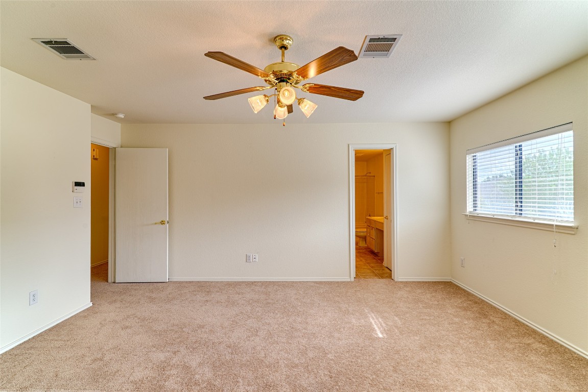 6433 Tara Drive Austin, TX 78747 - Photo 6 of 9 a view of a livingroom with a ceiling fan and window