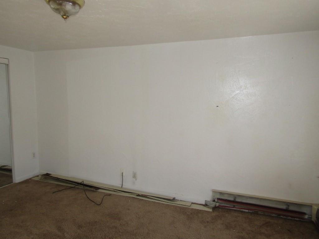 84 2nd Street California, PA 15419 - Photo 19 of 28 an empty room with a bench