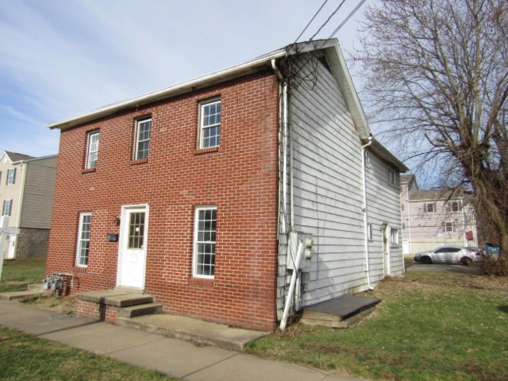 84 2nd Street California, PA 15419 - Photo 3 of 28 a front view of a house with a yard