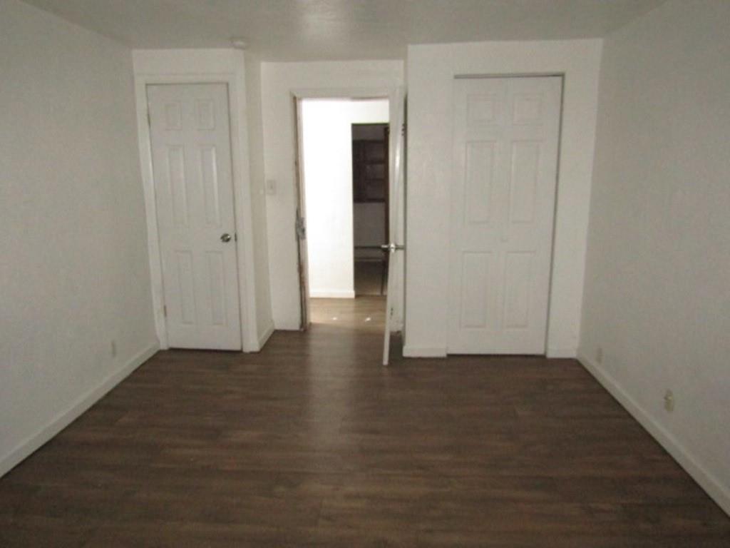 84 2nd Street California, PA 15419 - Photo 6 of 28 an empty room with wooden floor and closet