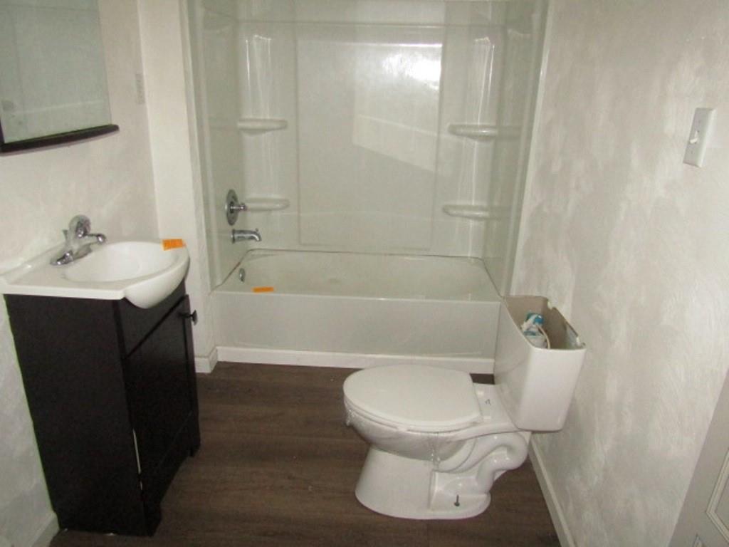 84 2nd Street California, PA 15419 - Photo 9 of 28 a white toilet sitting next to a bath tub