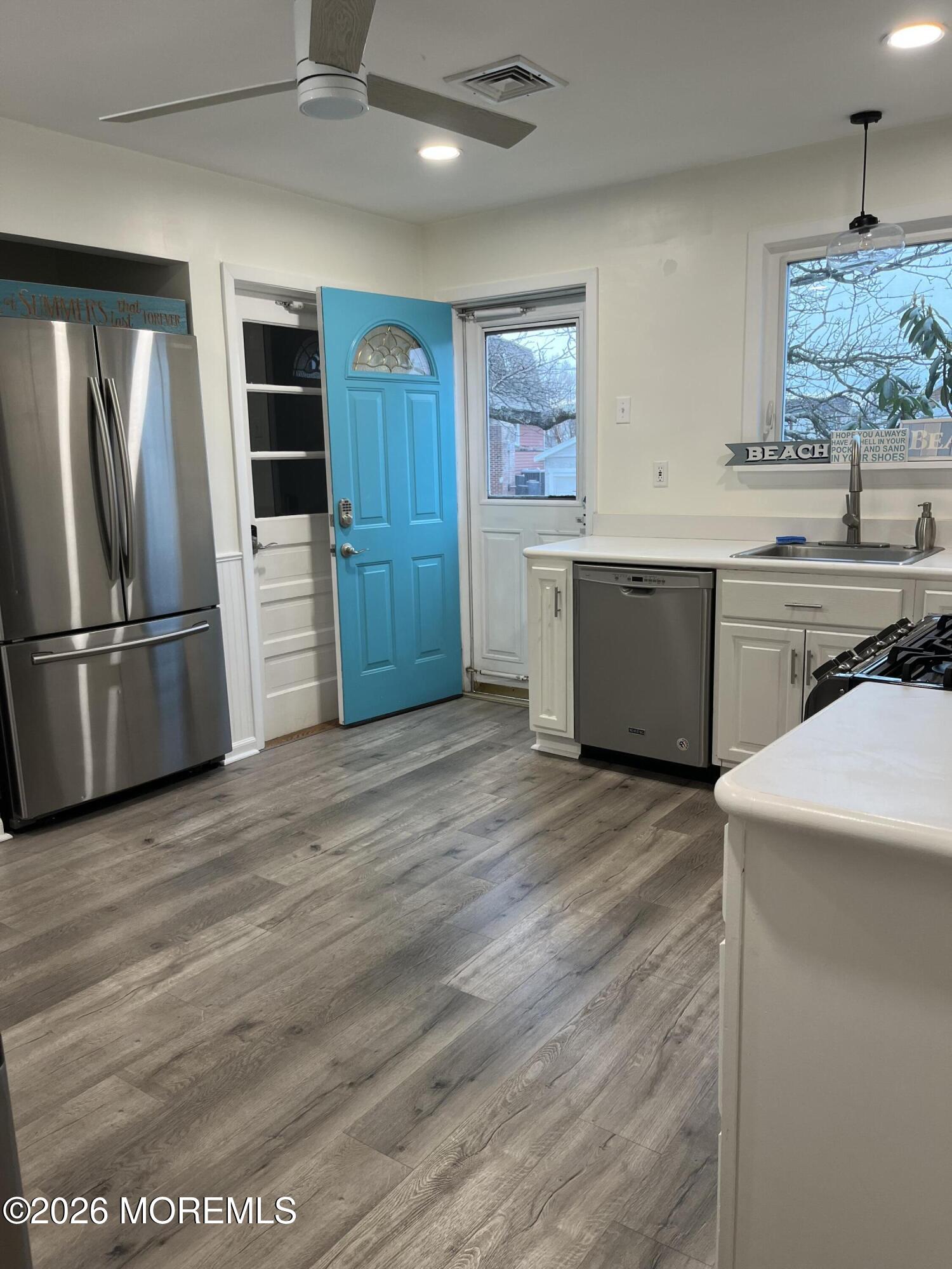 2001 Main Street Lake Como, NJ 07719 - Photo 5 of 26 a kitchen with stainless steel appliances kitchen island granite countertop a refrigerator and a stove
