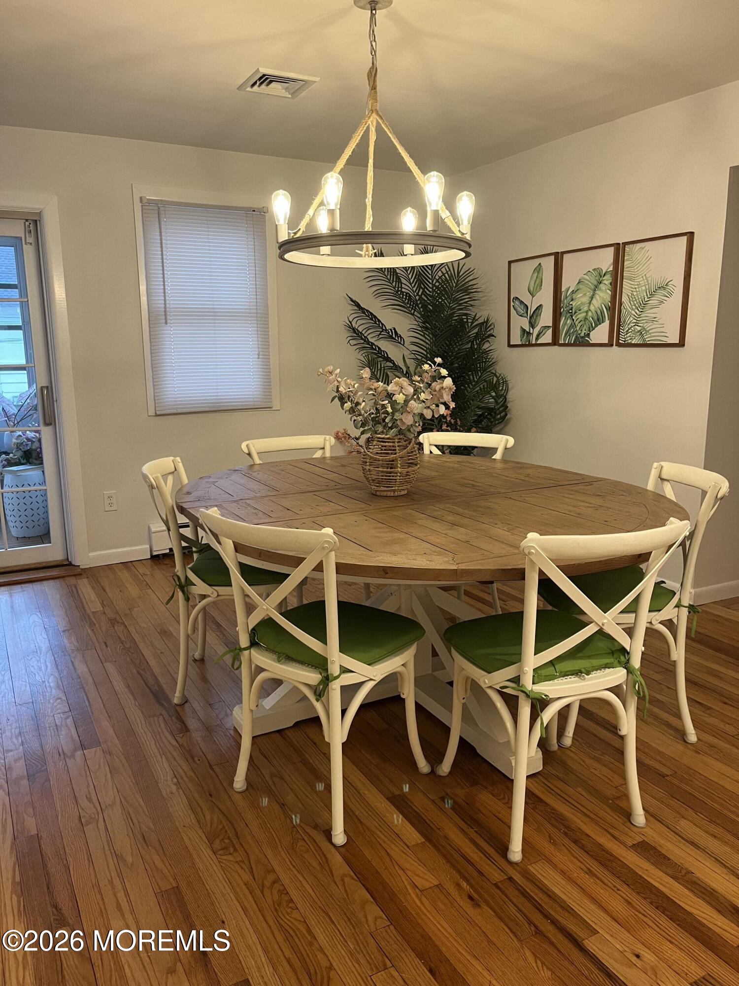 2001 Main Street Lake Como, NJ 07719 - Photo 7 of 26 a view of a dining room with furniture wooden floor and chandelier