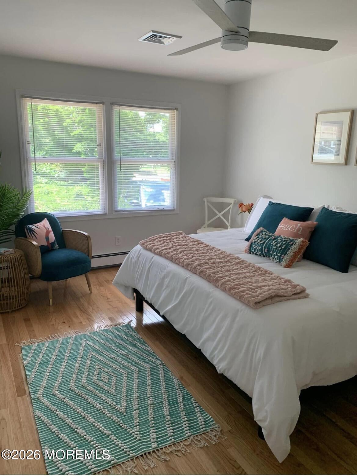 2001 Main Street Lake Como, NJ 07719 - Photo 10 of 26 a bedroom with a bed window and couch