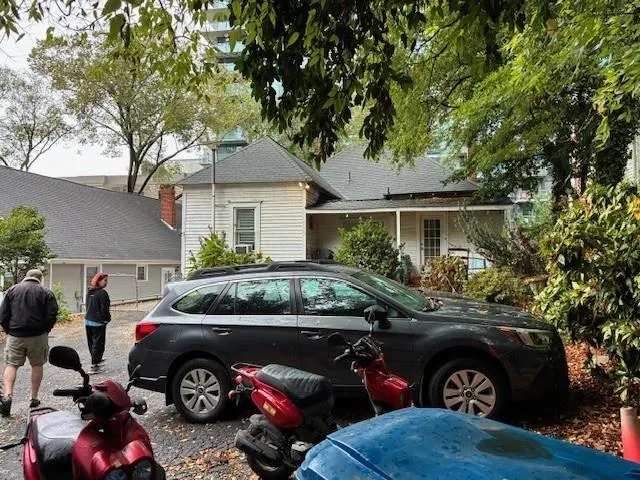 a front view of a house with parking space