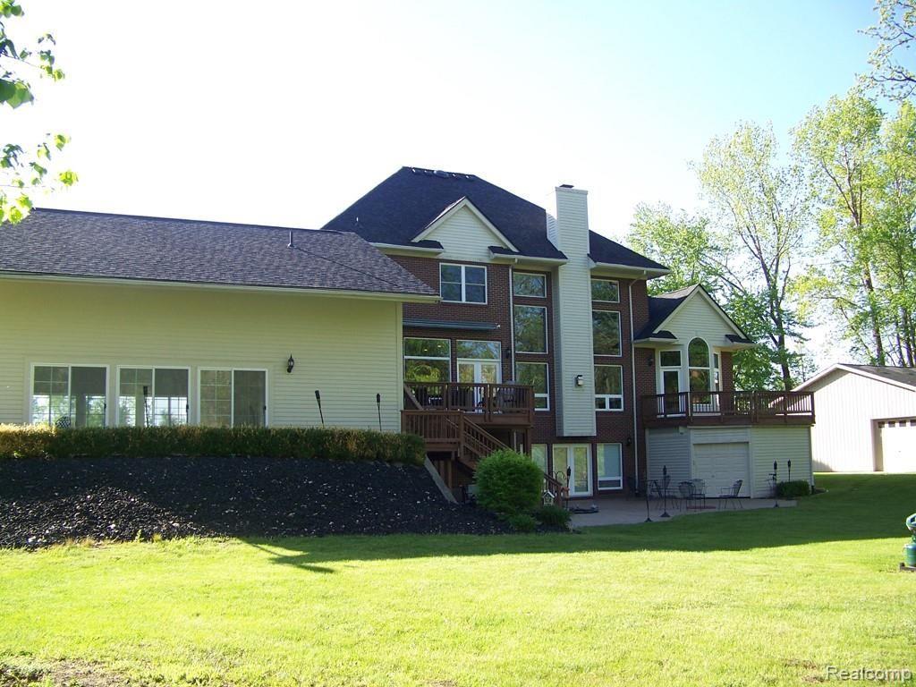 9247 Crockett Farm Road South Lyon, MI 48178 - Photo 43 of 50 43 house back.jpg