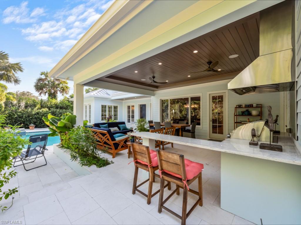 533 Turtle Hatch Lane Naples, FL 34103 - Photo 29 of 50 Even more seating surrounding summer kitchen