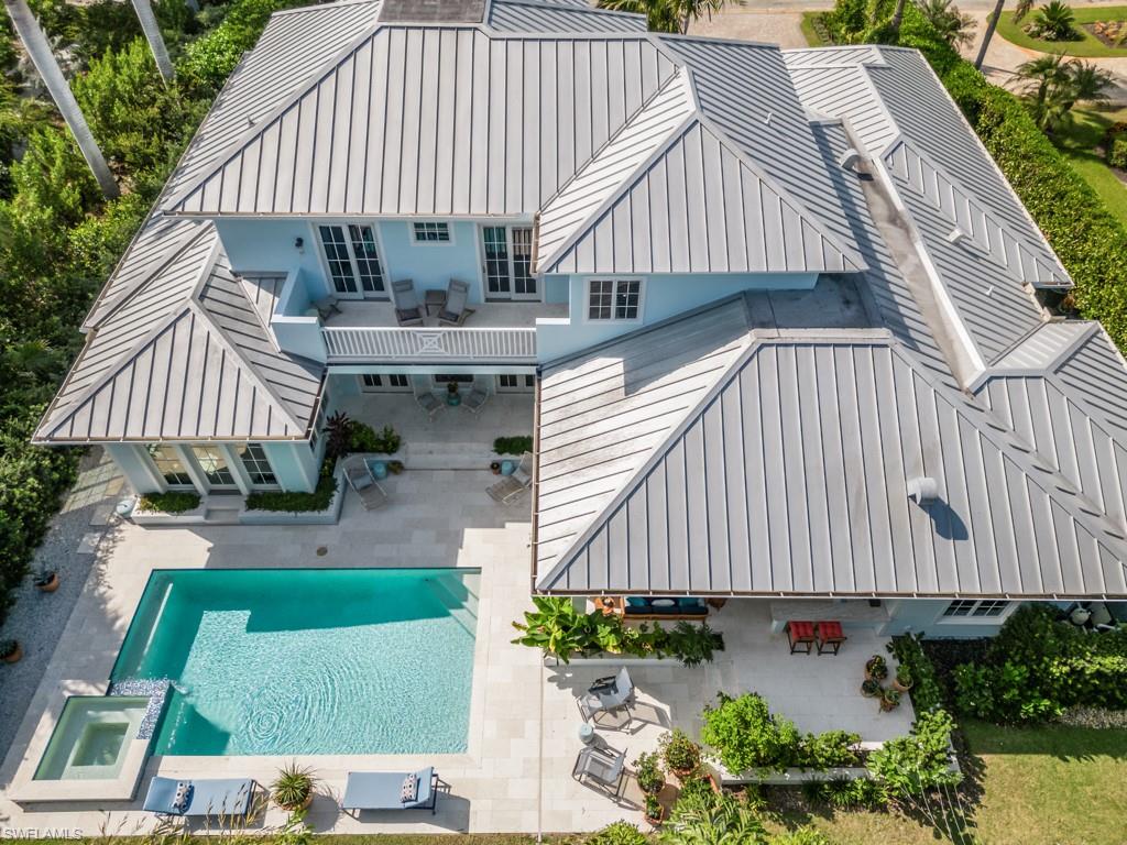 533 Turtle Hatch Lane Naples, FL 34103 - Photo 47 of 50 Second floor terrace accessible from all 3 guest suites