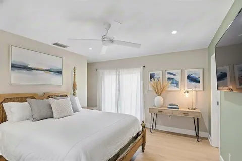 a bedroom with a bed and a cabinets