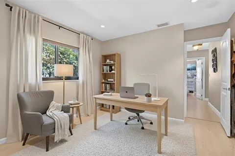 a workspace with furniture and a window