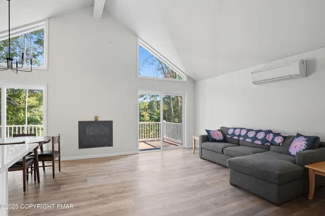 a living room with furniture or couch and a flat screen tv