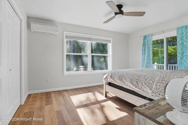 a bed sitting in a bedroom next to a window