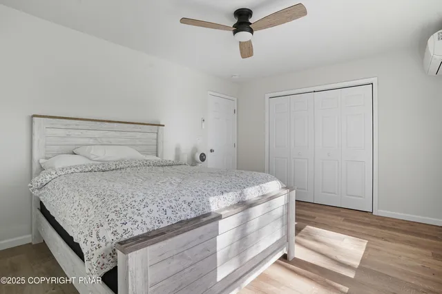 a bedroom with a bed and a walk in closet