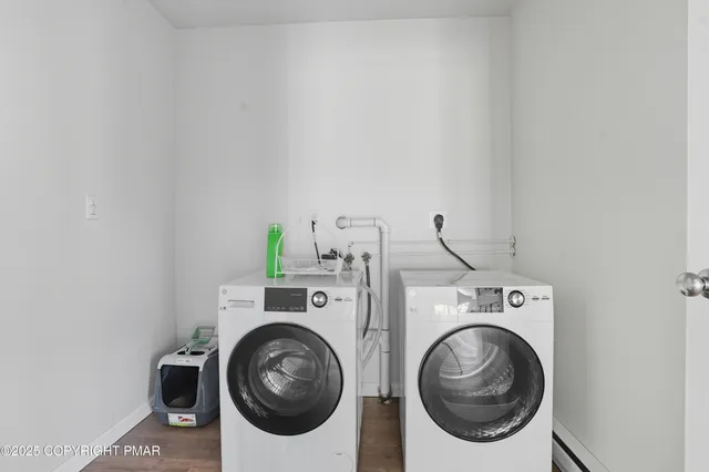 a utility room with dryer and washer