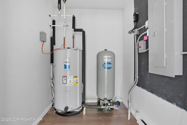 a view of an entryway with wooden floor
